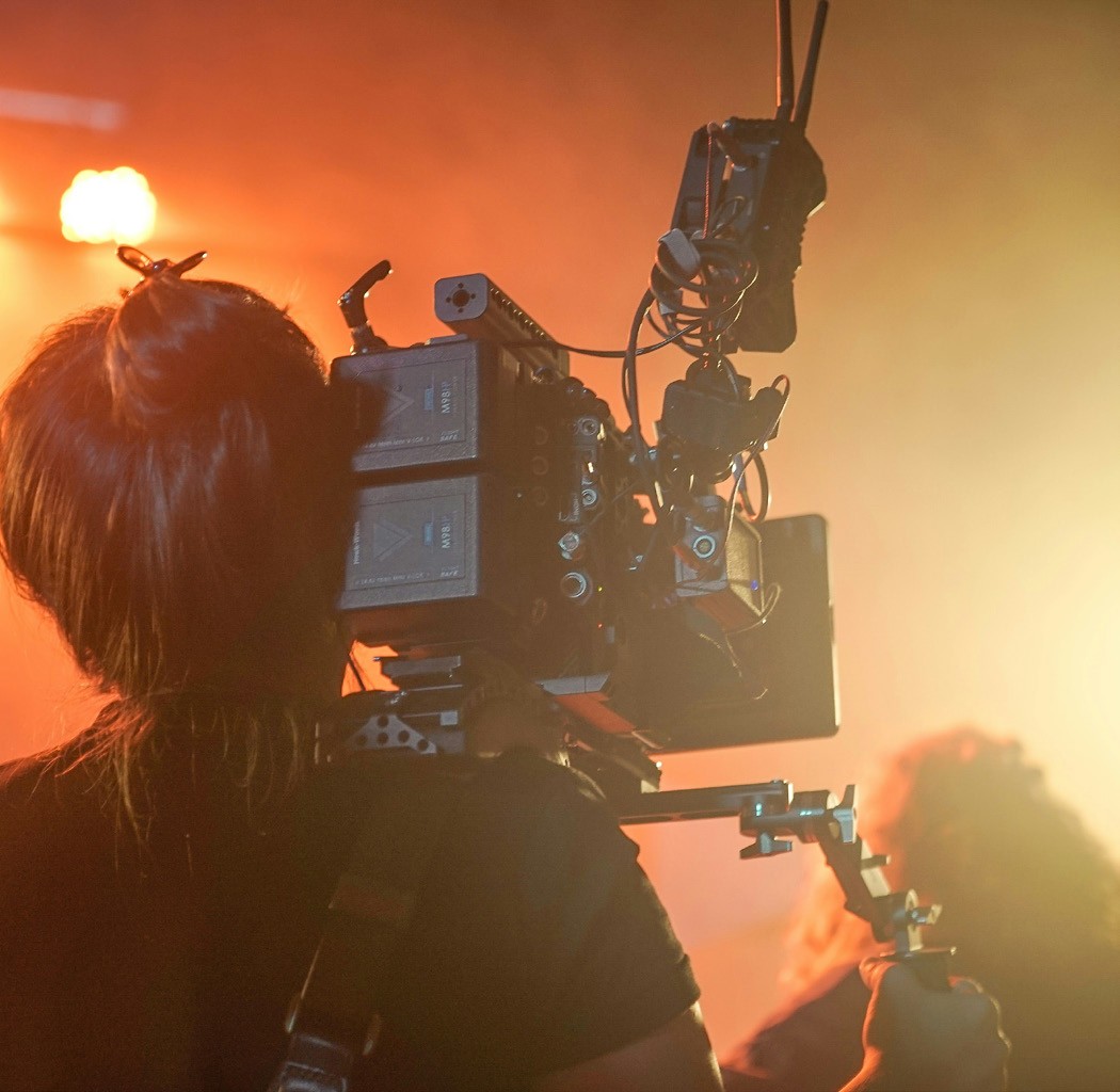 Camera operator with a professional broadcast camera
