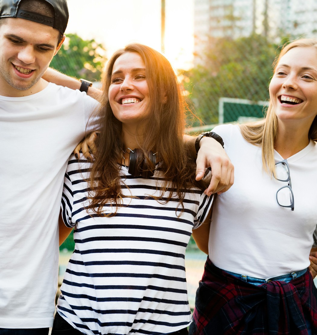 Three smiling LCU students with arms around each other